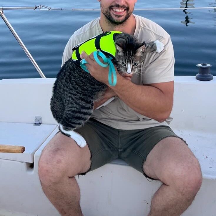 Zero on the boat with Random Guy