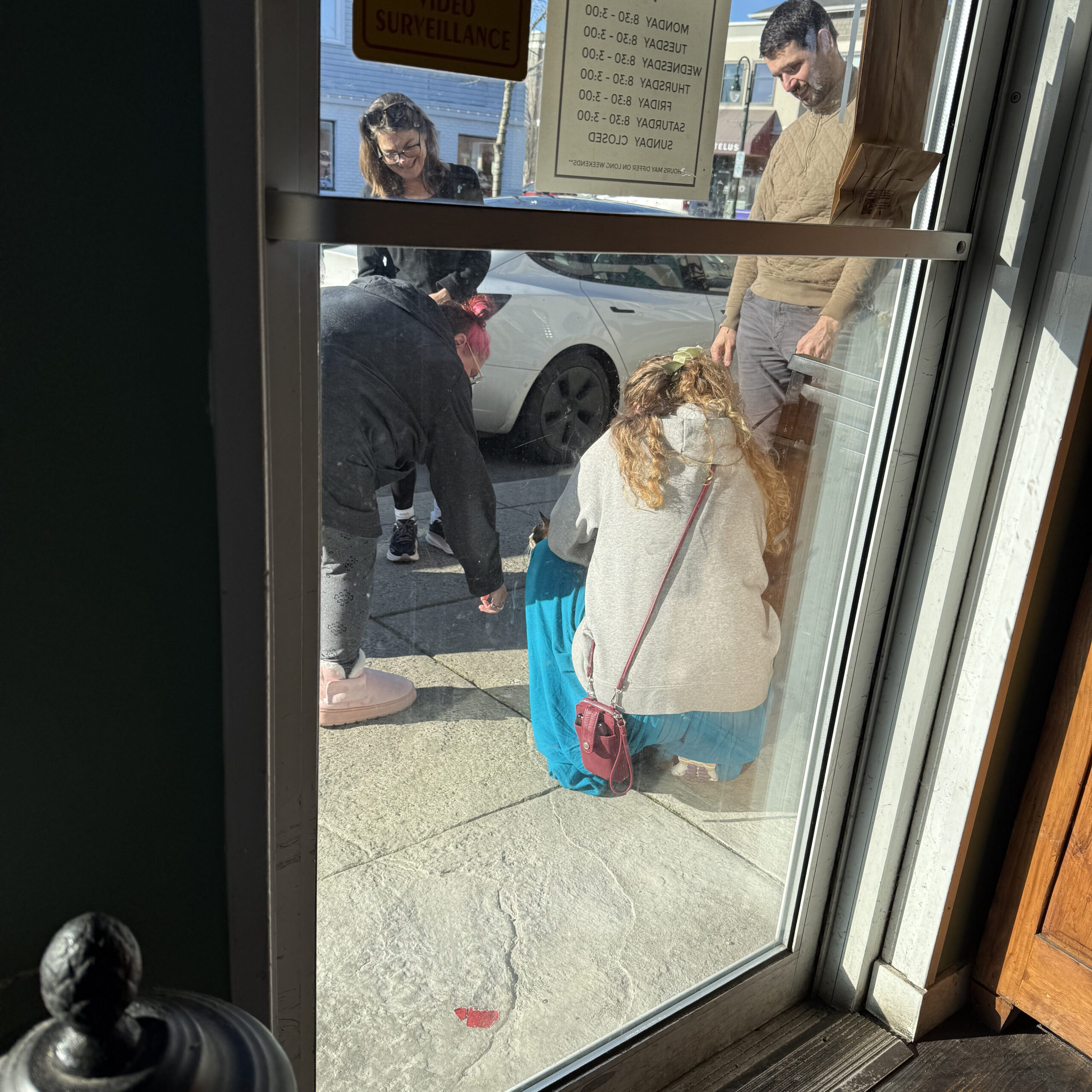 Zero being greeted by fans outside the cafe